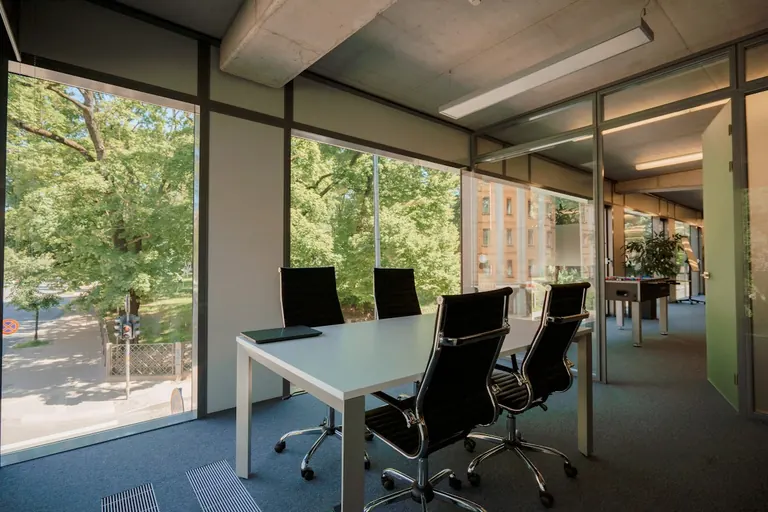 Bright meeting room with a table and chairs